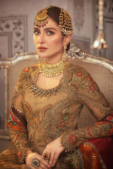 Antique gold organza frock neckline and sleeves embroidery close up
