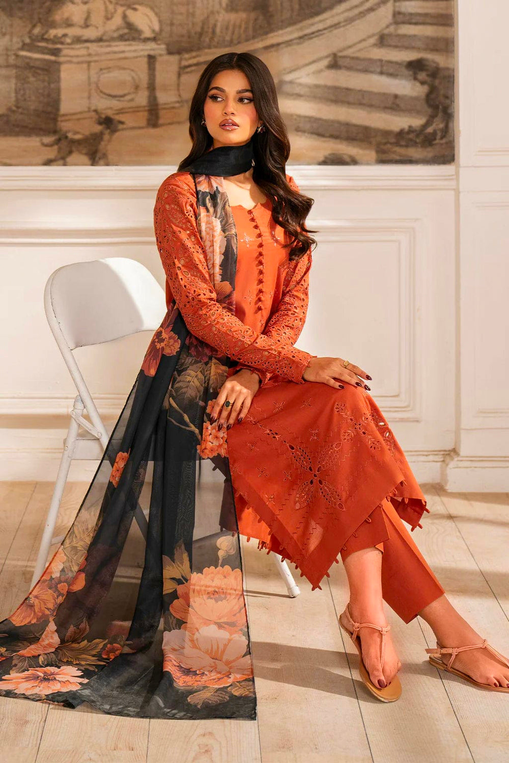Burnt orange chikankari lawn suit sitting model view with printed dupatta