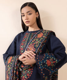 Deep navy lawn suit closeup with colorful floral embroidery and printed dupatta