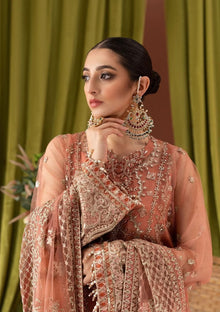 Dusty peach net suit neck embroidery and sleeve cuff closeup
