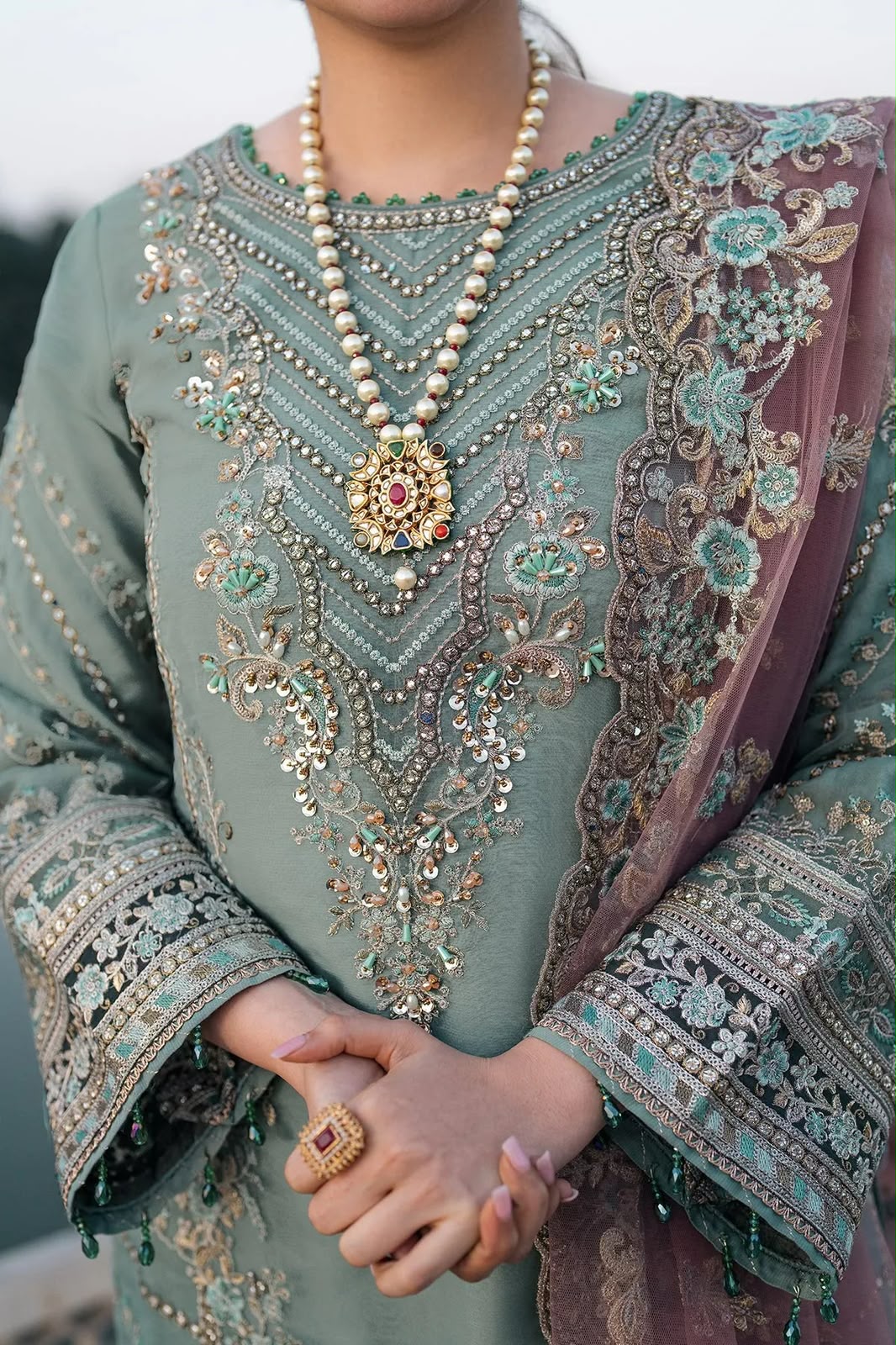 Dusty sage green chiffon suit neck embroidery and handwork closeup
