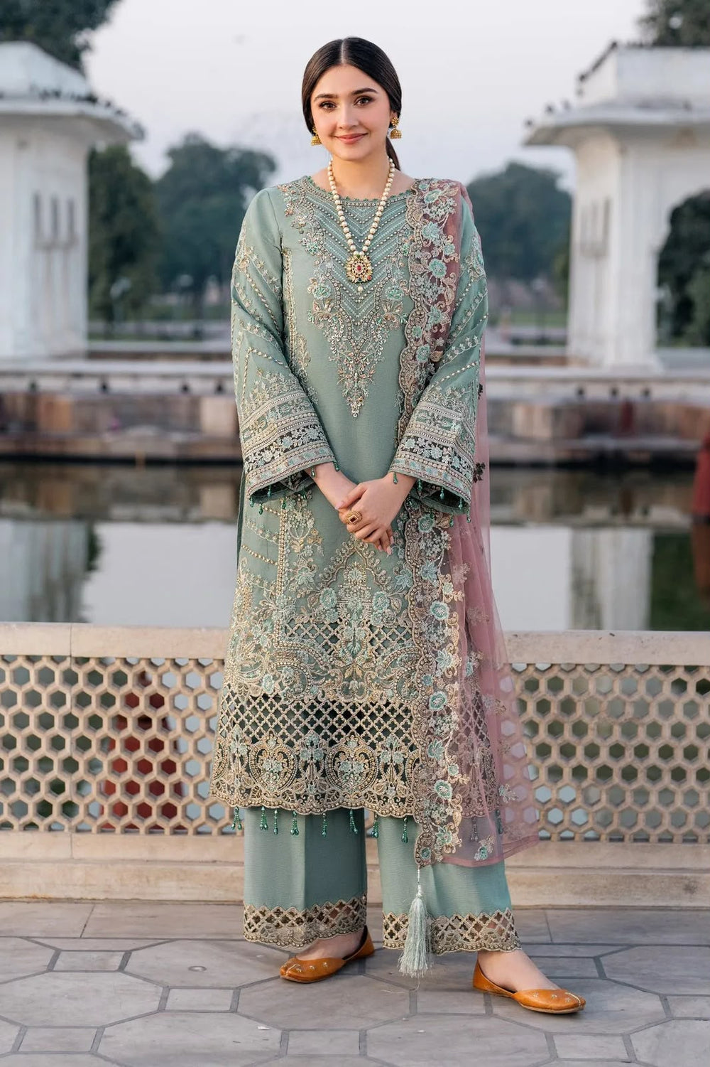 Dusty sage green heavy embroidered suit with net dupatta front model view