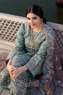 Dusty sage green heavy embroidered suit with net dupatta closeup model view