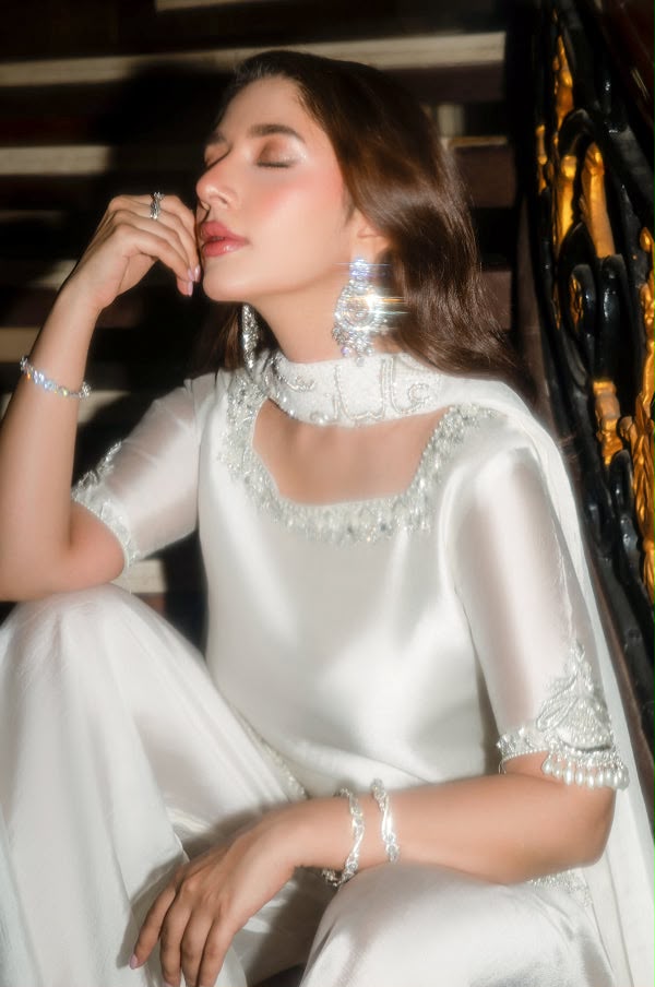 Pearl white shamoz silk suit neckline detail with embroidered patch
