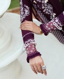 Plum embroidered suit sleeve cuff closeup with embroidery detailing