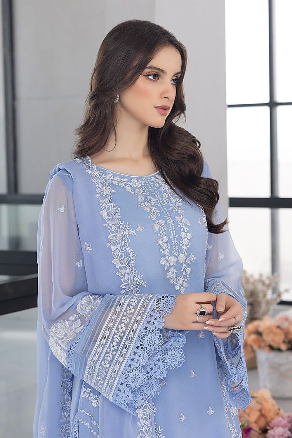 Powder blue organza suit close up showing embroidered neckline and sleeves