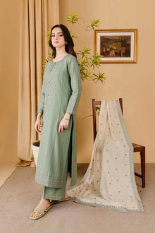 Sage green embroidered lawn suit model side view with embroidered dupatta