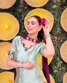 Soft mint embroidered silk suit neckline and sleeve detail

